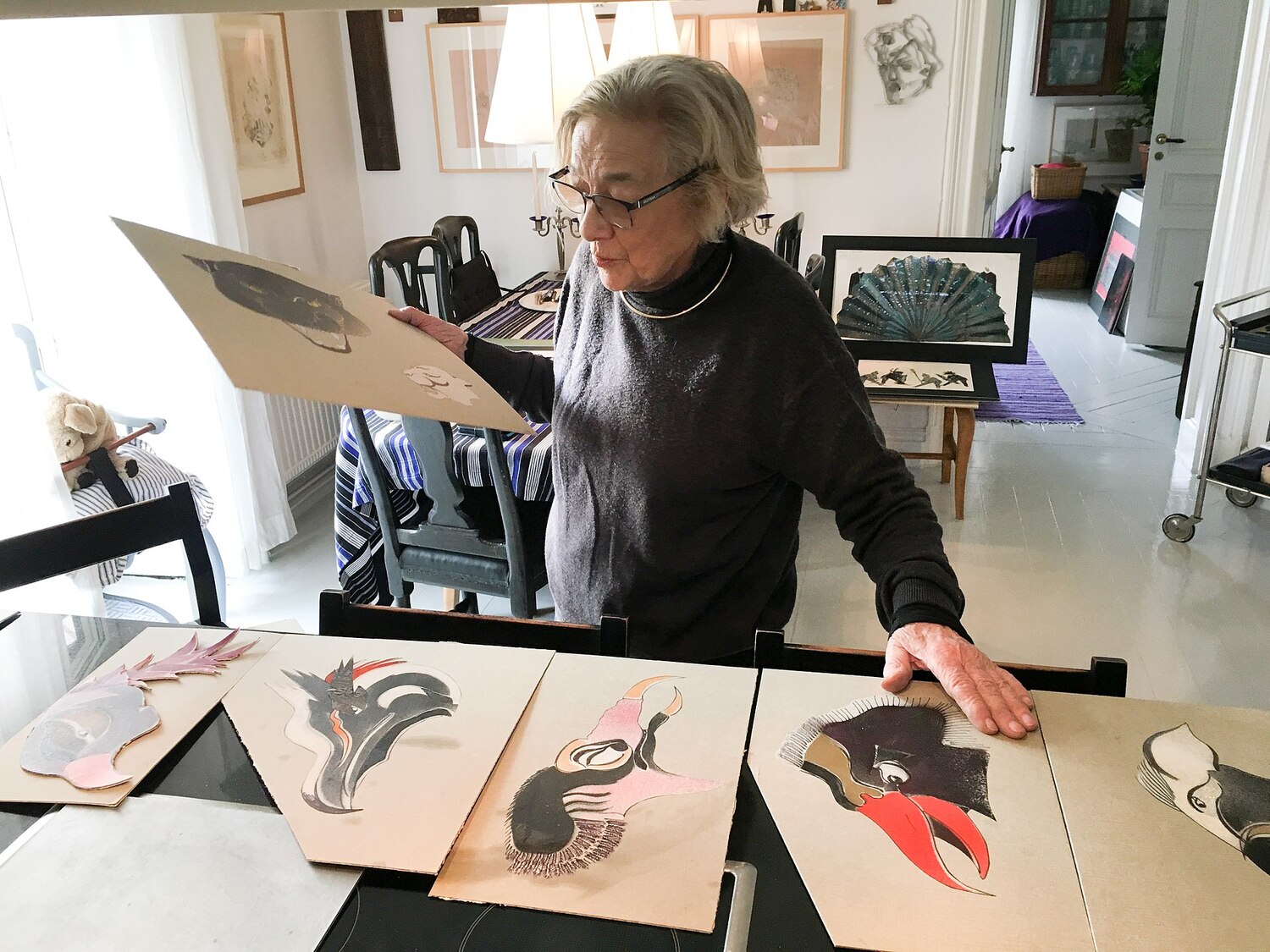  The artist choosing sketches for an exhibtion.